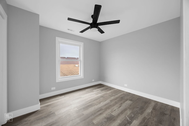 6158 S Austin Ave, Chicago, IL 60638 - spare room featuring a ceiling fan and wood finished floors