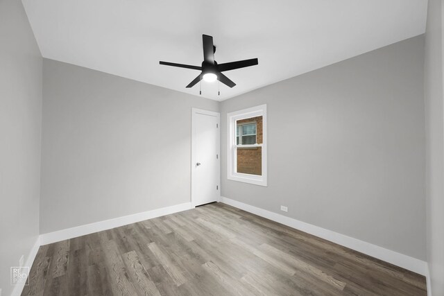 6158 S Austin Ave, Chicago, IL 60638 - unfurnished room with wood finished floors and ceiling fan