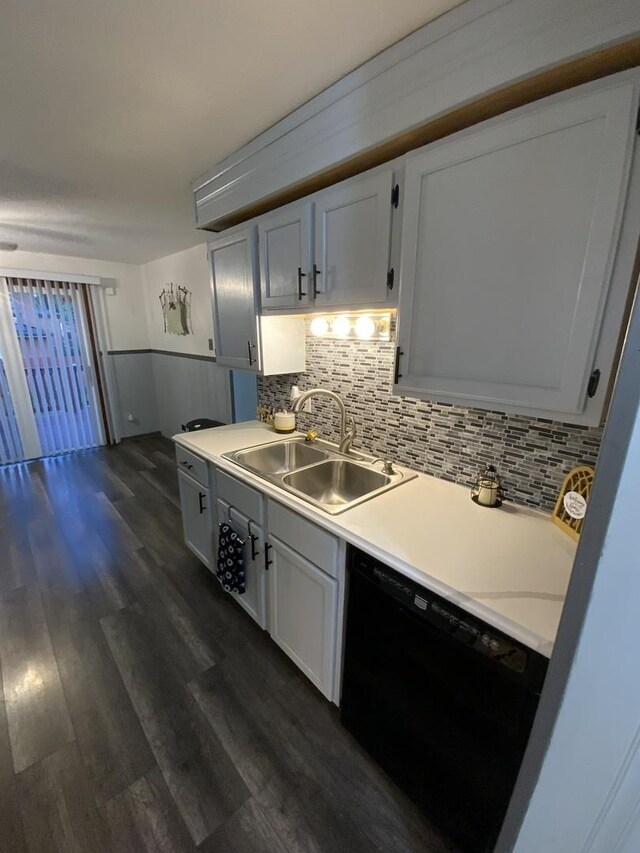 14441 Dante Ave, Dolton, IL 60419 - kitchen featuring dishwasher, dark wood-style flooring, light countertops, decorative backsplash, and wainscoting