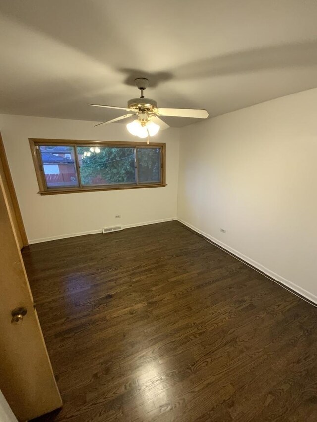 14441 Dante Ave, Dolton, IL 60419 - unfurnished room featuring dark wood-style floors and ceiling fan