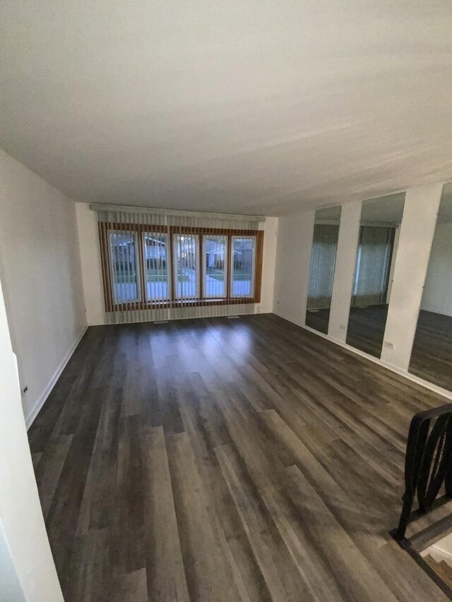 14441 Dante Ave, Dolton, IL 60419 - unfurnished living room featuring dark wood finished floors