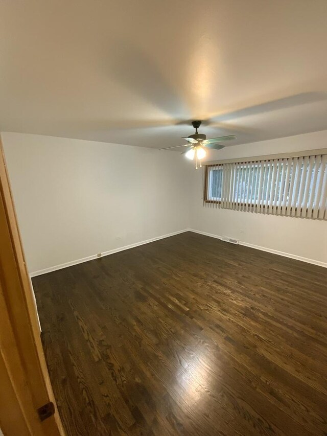 14441 Dante Ave, Dolton, IL 60419 - spare room featuring a ceiling fan and dark wood finished floors