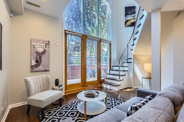 1622 W Ontario St Unit 1E, Chicago, IL 60622 - living area featuring stairs, wood finished floors, and a high ceiling