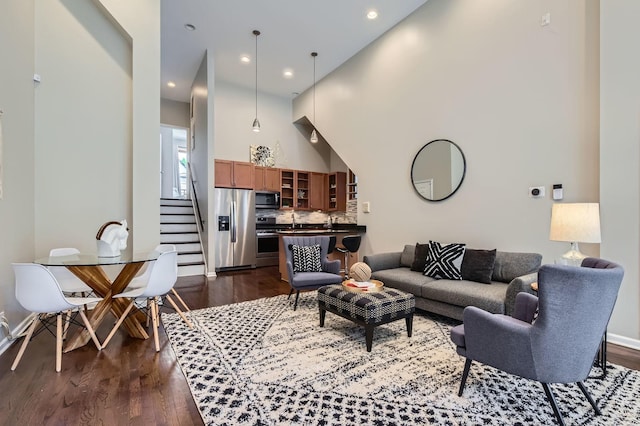 1622 W Ontario St Unit 1E, Chicago, IL 60622 - living room featuring dark wood finished floors, stairway, and recessed lighting