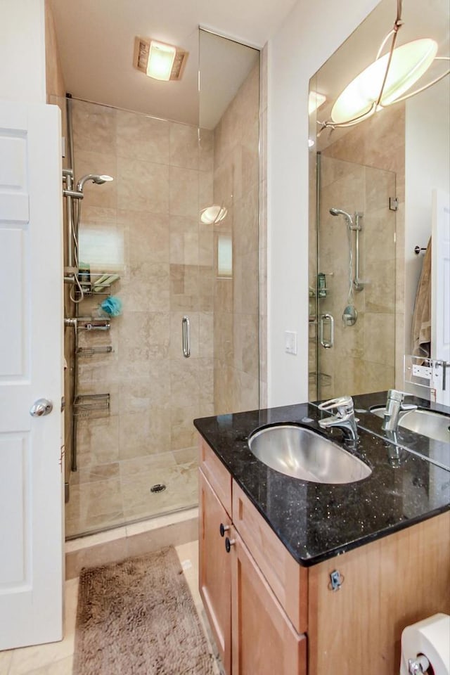 1622 W Ontario St Unit 1E, Chicago, IL 60622 - bathroom featuring a stall shower, vanity, and tile patterned floors