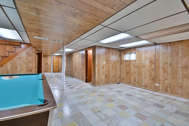 5010 N Merrimac Ave, Chicago, IL 60630 - playroom with tile patterned floors and wood walls