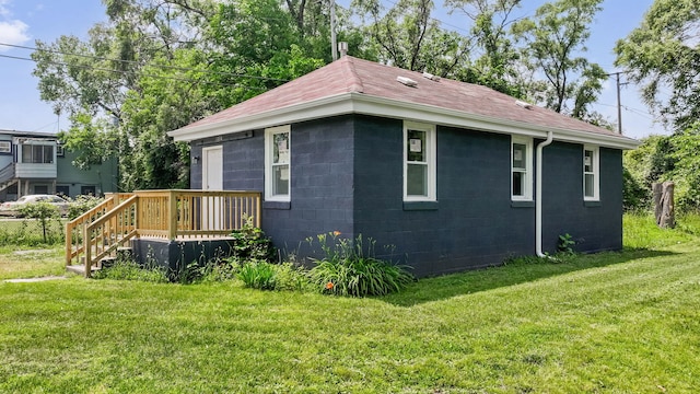 13834 Turner Ave, Robbins, IL 60472 - view of side of home with a lawn, concrete block siding, and a shingled roof