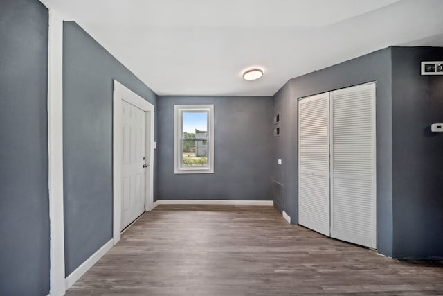 13834 Turner Ave, Robbins, IL 60472 - unfurnished bedroom with wood finished floors and baseboards