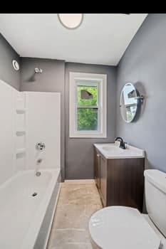 13834 Turner Ave, Robbins, IL 60472 - bathroom featuring vanity, shower / tub combination, and tile patterned flooring