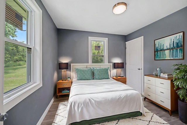 13834 Turner Ave, Robbins, IL 60472 - bedroom with multiple windows and wood finished floors