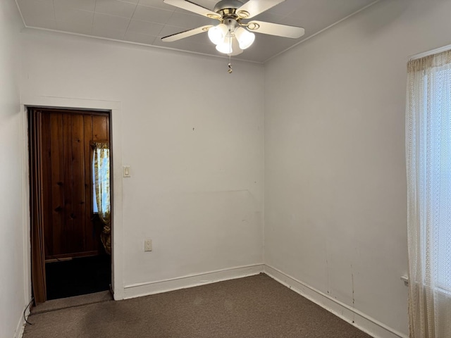 7022 S Claremont Ave, Chicago, IL 60636 - empty room with a ceiling fan and dark colored carpet