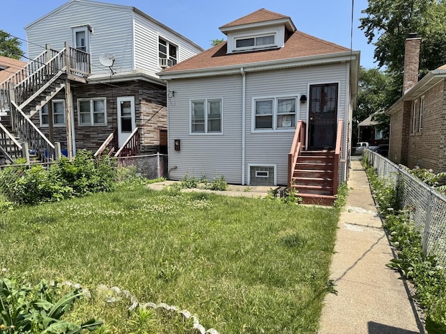 7022 S Claremont Ave, Chicago, IL 60636 - rear view of house featuring stairs, a fenced backyard, roof with shingles, and entry steps