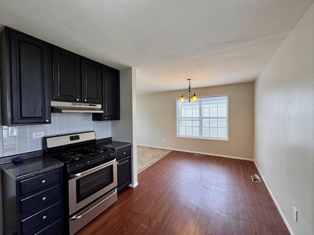 20552 S Frankfort Square Rd, Frankfort, IL 60423 - kitchen featuring stainless steel gas stove, under cabinet range hood, dark cabinets, dark countertops, and decorative backsplash