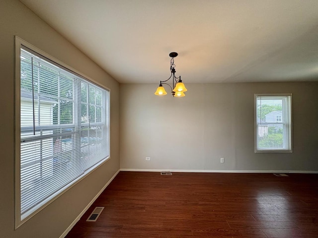 20552 S Frankfort Square Rd, Frankfort, IL 60423 - empty room with a chandelier and dark wood-type flooring