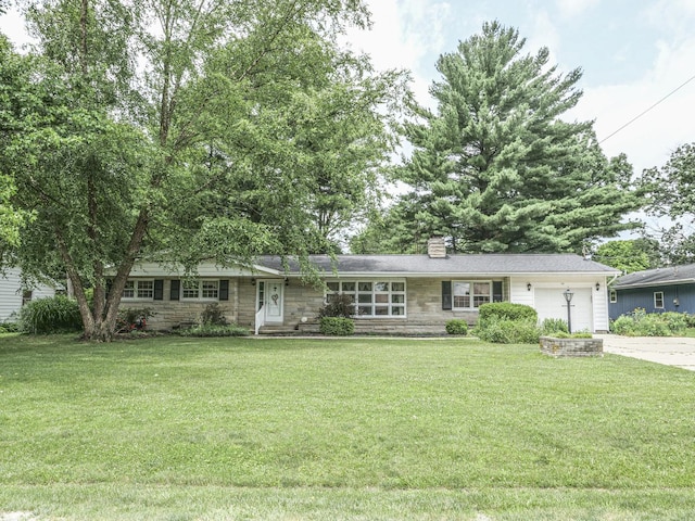 110 Hickory, Villa Grove, IL 61956 - single story home with stone siding, an attached garage, concrete driveway, a chimney, and a front lawn