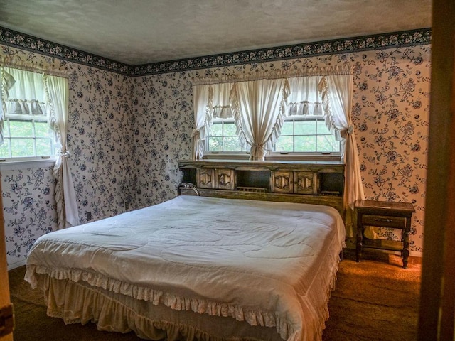 110 Hickory, Villa Grove, IL 61956 - bedroom with wallpapered walls and multiple windows