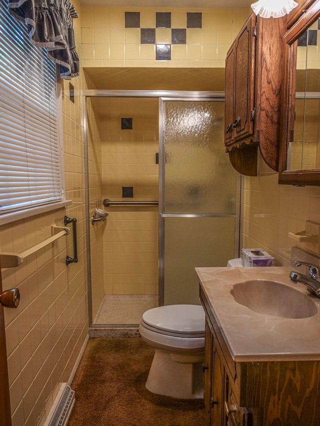 110 Hickory, Villa Grove, IL 61956 - bathroom featuring tile walls, a shower stall, and vanity