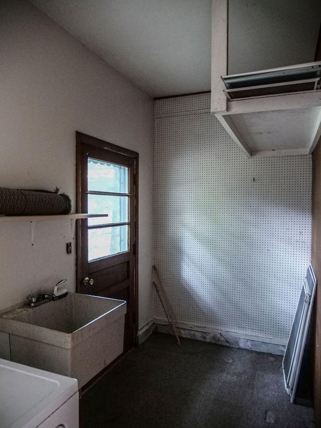 110 Hickory, Villa Grove, IL 61956 - laundry room featuring dark colored carpet and washer / clothes dryer