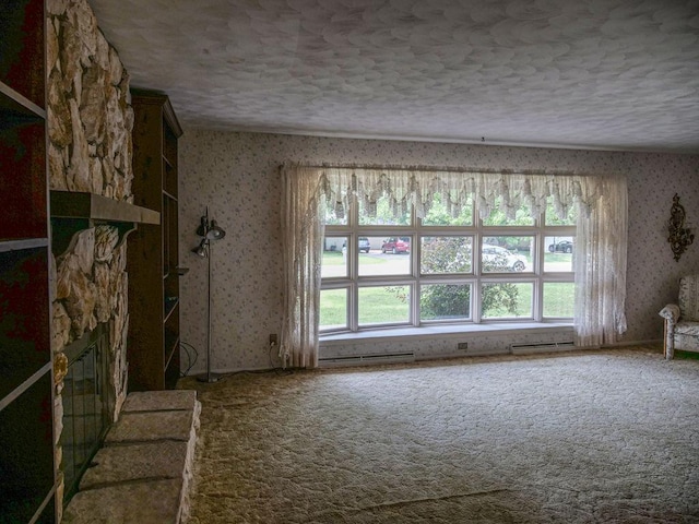 110 Hickory, Villa Grove, IL 61956 - carpeted spare room featuring wallpapered walls and a textured ceiling