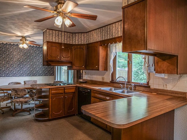 110 Hickory, Villa Grove, IL 61956 - kitchen with wallpapered walls, a peninsula, black dishwasher, ceiling fan, and dark colored carpet