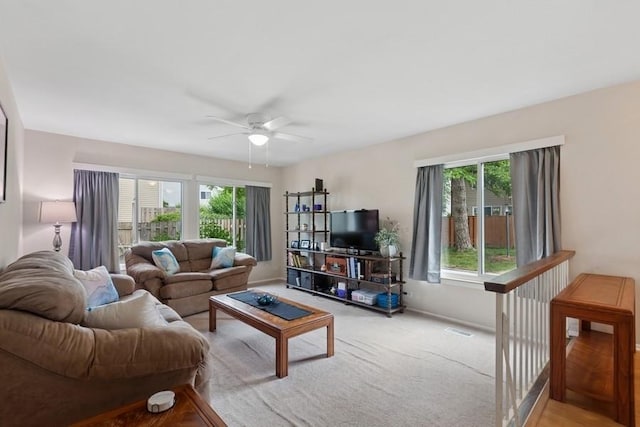 738 Colorado Ct, Carol Stream, IL 60188 - living area featuring healthy amount of natural light, a ceiling fan, and carpet floors