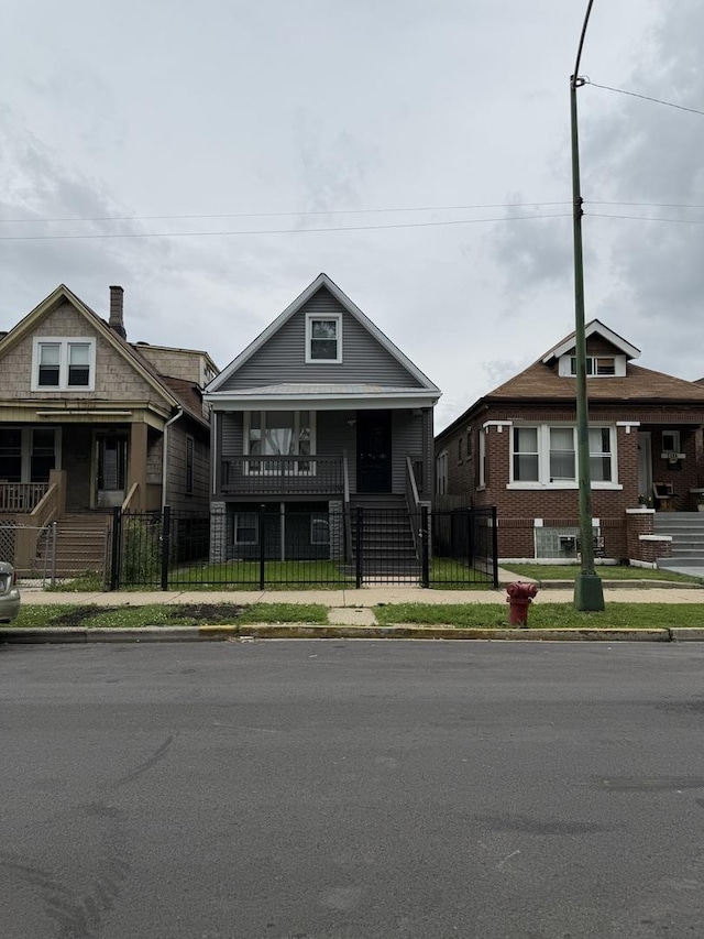 7130 S Morgan St, Chicago, IL 60621 - view of front of property featuring covered porch, a fenced front yard, and a gate