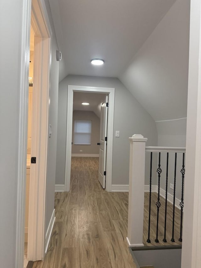 7130 S Morgan St, Chicago, IL 60621 - hallway featuring wood finished floors, lofted ceiling, and an upstairs landing