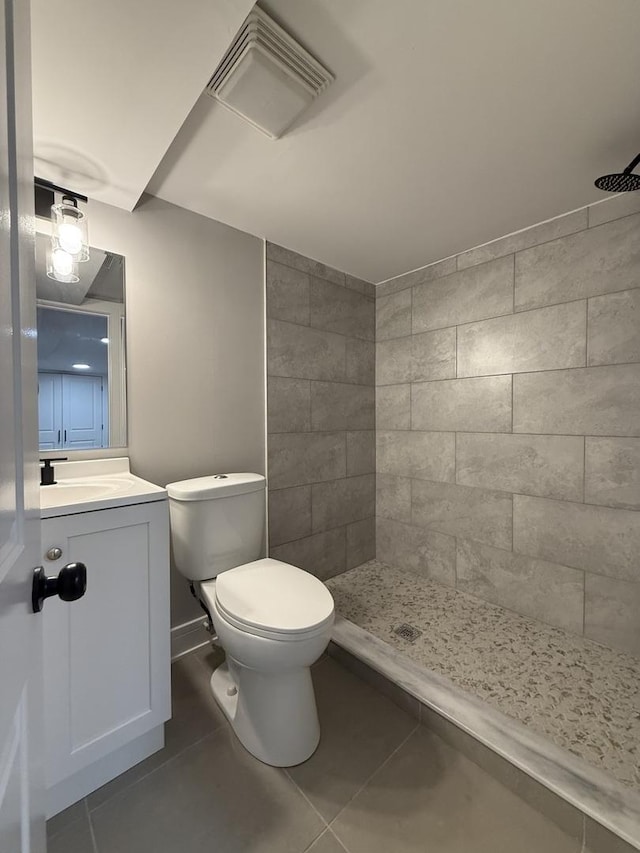7130 S Morgan St, Chicago, IL 60621 - bathroom featuring tiled shower, tile patterned floors, and vanity
