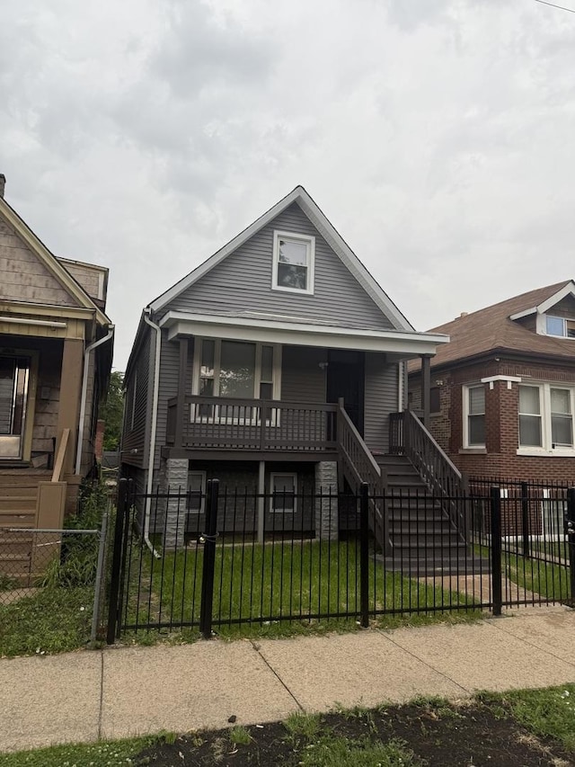 7130 S Morgan St, Chicago, IL 60621 - bungalow-style home with a porch, a fenced front yard, stairs, and a gate