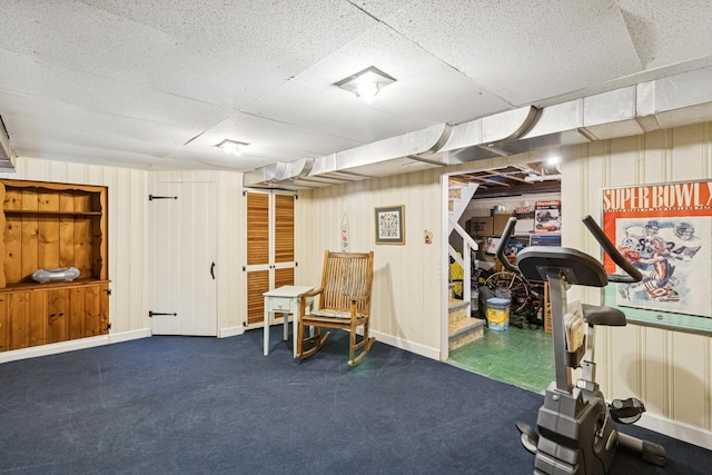 3921 Franklin Ave, Western Springs, IL 60558 - exercise room featuring carpet floors, a paneled ceiling, and wooden walls