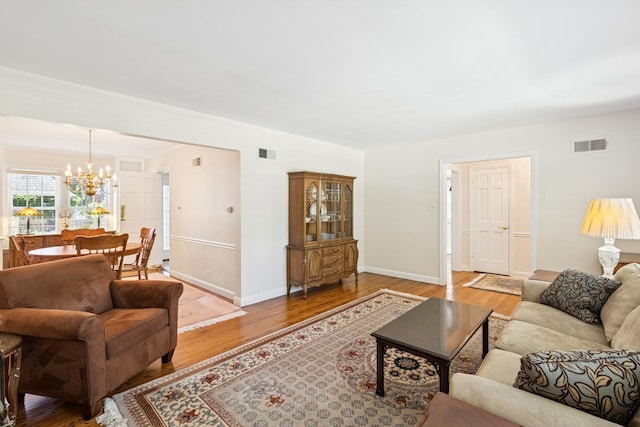 3921 Franklin Ave, Western Springs, IL 60558 - living room featuring a chandelier and wood finished floors