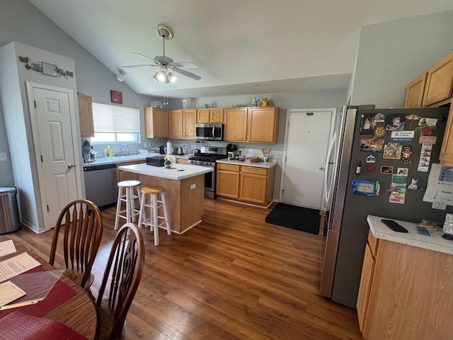 2311 White Eagle Dr, Plainfield, IL 60586 - kitchen with appliances with stainless steel finishes, a center island, lofted ceiling, dark wood finished floors, and ceiling fan
