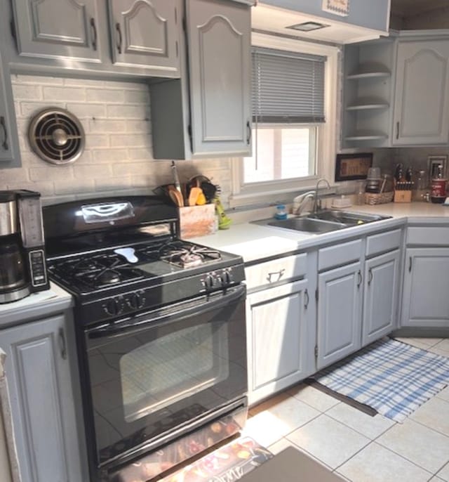 35 Douglas Ct, Hoffman Estates, IL 60169 - kitchen featuring black gas stove, gray cabinetry, light countertops, and light tile patterned floors