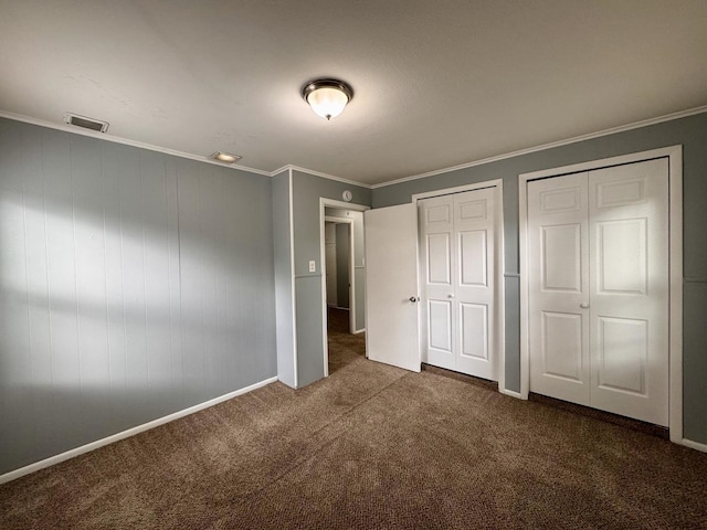336 Marquette St, Park Forest, IL 60466 - unfurnished bedroom with multiple closets, carpet flooring, and crown molding