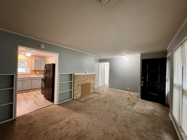 336 Marquette St, Park Forest, IL 60466 - unfurnished living room with crown molding and light carpet