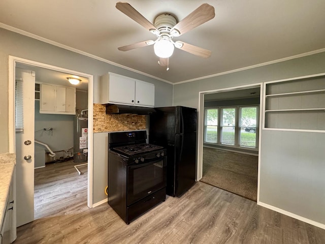 336 Marquette St, Park Forest, IL 60466 - kitchen featuring black appliances, under cabinet range hood, light wood-style flooring, gas water heater, and crown molding