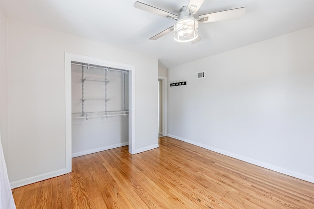19749 Mokena St, Mokena, IL 60448 - unfurnished bedroom with a closet, light wood-style floors, and ceiling fan
