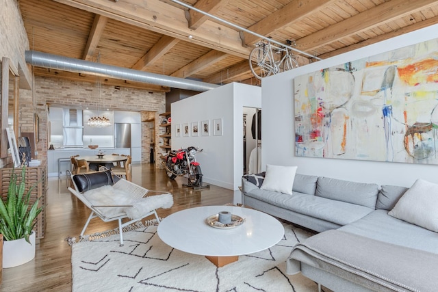 1017 W Washington Blvd Unit 2H, Chicago, IL 60607 - living area featuring a wood ceiling with exposed beams, brick wall, and wood finished floors