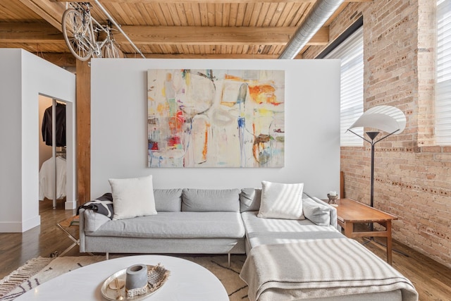 1017 W Washington Blvd Unit 2H, Chicago, IL 60607 - living room featuring brick wall, wood finished floors, and a wood ceiling with exposed beams