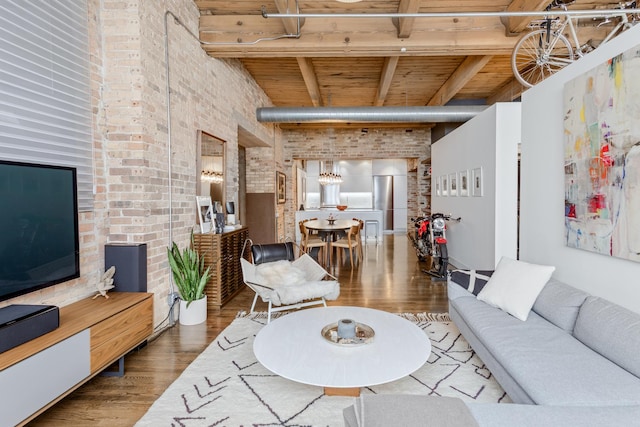 1017 W Washington Blvd Unit 2H, Chicago, IL 60607 - living room with a wood ceiling with exposed beams, brick wall, wood finished floors, and a chandelier