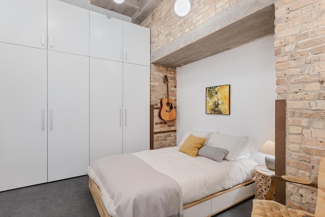 1017 W Washington Blvd Unit 2H, Chicago, IL 60607 - bedroom with brick wall and carpet floors