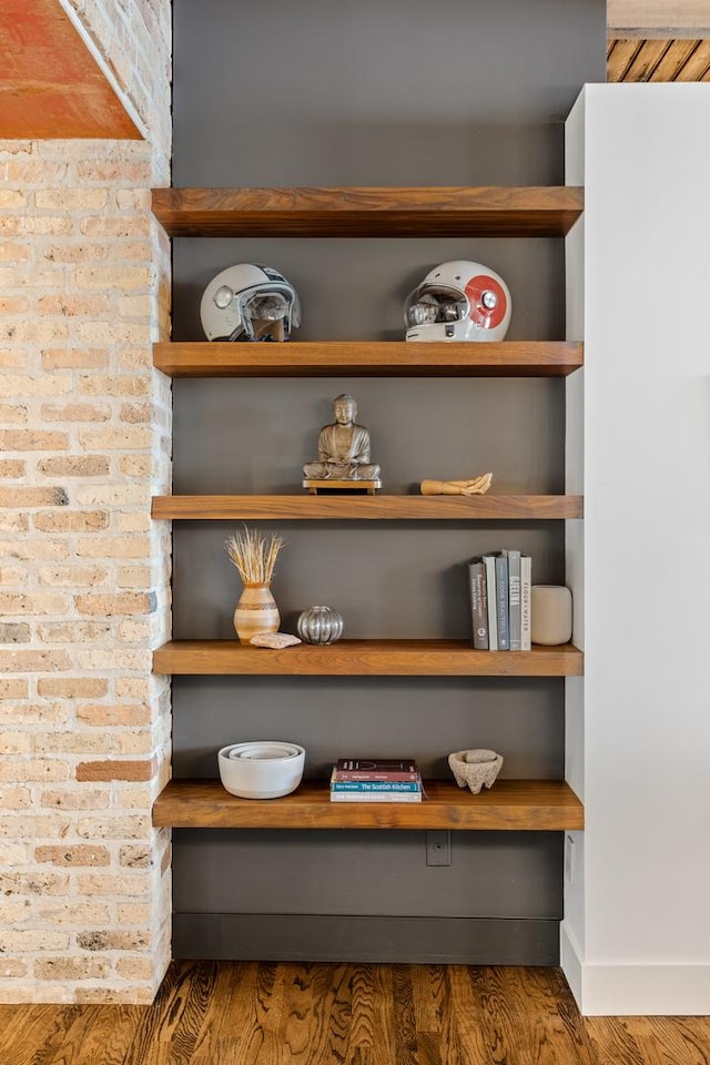 1017 W Washington Blvd Unit 2H, Chicago, IL 60607 - detailed view of wood finished floors and brick wall