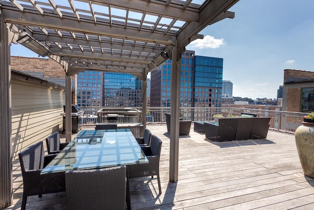 1017 W Washington Blvd Unit 2H, Chicago, IL 60607 - deck with a pergola, outdoor dining area, outdoor lounge area, grilling area, and a view of city