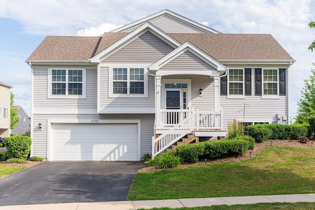 1113 Sapphire Ln, Pingree Grove, IL 60140 - view of front facade with asphalt driveway, an attached garage, a front lawn, and roof with shingles