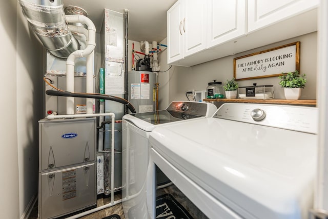 1113 Sapphire Ln, Pingree Grove, IL 60140 - laundry room featuring separate washer and dryer, water heater, cabinet space, and heating unit