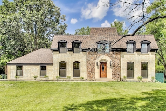 151 S Whitehall Ct, Palatine, IL 60067 - french country style house with a front lawn, roof with shingles, and brick siding