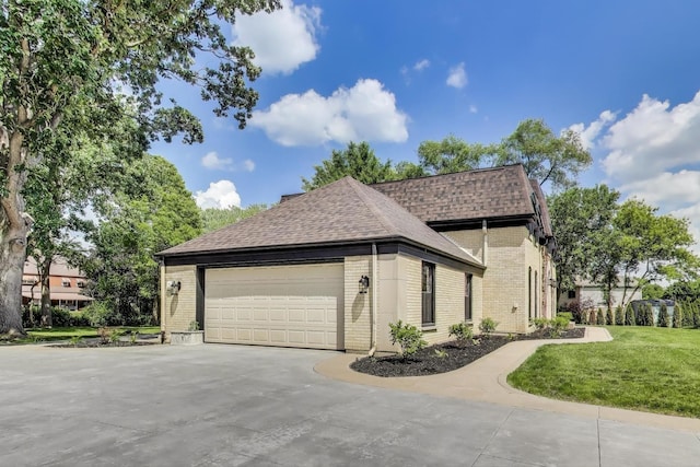 151 S Whitehall Ct, Palatine, IL 60067 - view of side of home featuring brick siding, a shingled roof, concrete driveway, a lawn, and an attached garage