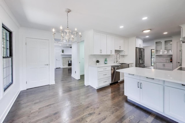 151 S Whitehall Ct, Palatine, IL 60067 - kitchen featuring stainless steel appliances, a chandelier, light countertops, white cabinetry, and dark wood-type flooring