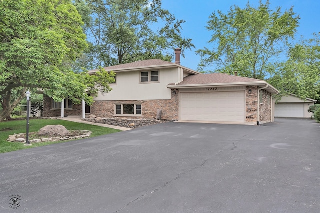 17242 Odell Ave, Tinley Park, IL 60477 - split level home with an attached garage, driveway, and a shingled roof
