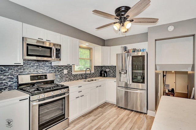 17242 Odell Ave, Tinley Park, IL 60477 - kitchen with stainless steel appliances, white cabinetry, light wood-type flooring, a ceiling fan, and tasteful backsplash